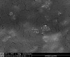 Figure 4  SEM micrograph of enamel after application of nanoparticle hydroxyapatite gel. Note that some nanoparticle hydroxyapatites remain on the enamel surface (x40000 magnification).