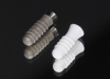 Fig 1. Titanium (left) and zirconia (right) implants.