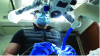 Fig 15. After chairside coloring, staining, and firing of the restoration, the air-abrasion process was monitored under the microscope to prevent damage to the stained surfaces of the restoration.