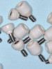 Fig 13. Polyether ether ketone healing abutments cleaned and sterilized after their use in patients.